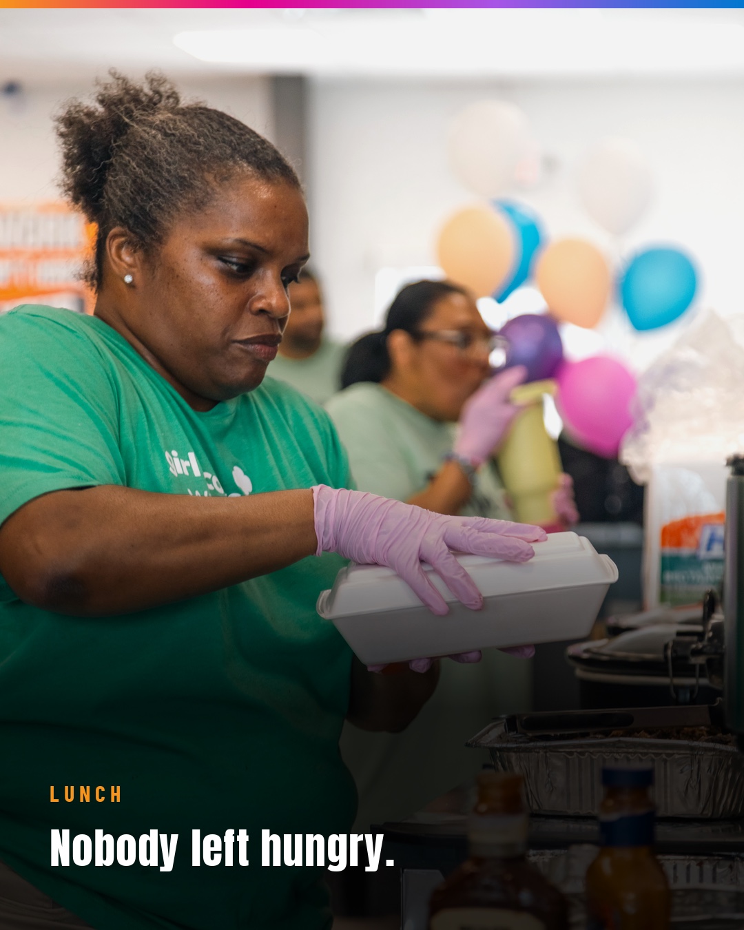 A volunteer preparing lunch so every Day of Hope guest could eat.