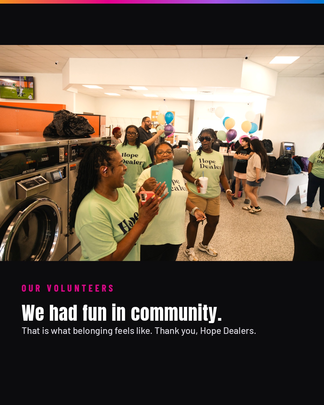 Hope Dealer volunteers laughing together inside Spin City Laundry.